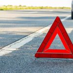 image-red-emergency-stop-sign-red-triangle-warning-sign-and-broken-car-on-a-road