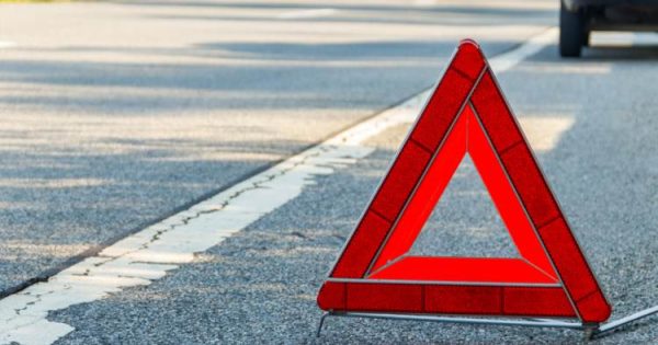 image-red-emergency-stop-sign-red-triangle-warning-sign-and-broken-car-on-a-road