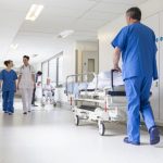 image-doctors-hospital-corridor-nurse-pushing-gurney-stretcher-bed