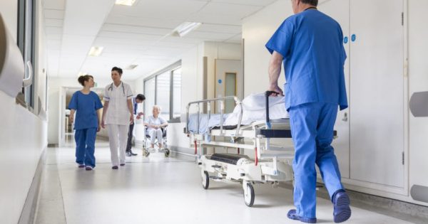 image-doctors-hospital-corridor-nurse-pushing-gurney-stretcher-bed
