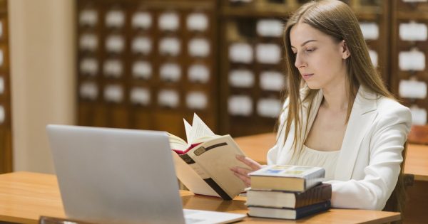 image-back-school-concept-with-woman-studying-library-1756680